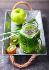 Smoothies of green vegetables and fruits.Kiwi,Apple,spinach,Chia seeds.Drink Concept of Healthy Eating. selective focus.