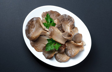 Pickled Oyster Mushrooms laid on a white plate