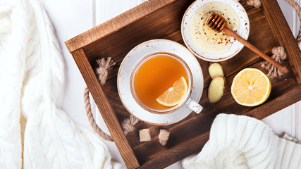 Cup of Ginger Tea with Lemon and Honey on a White Background.Concept Of Healthy Eating. top view. Copy space.  selective focus.