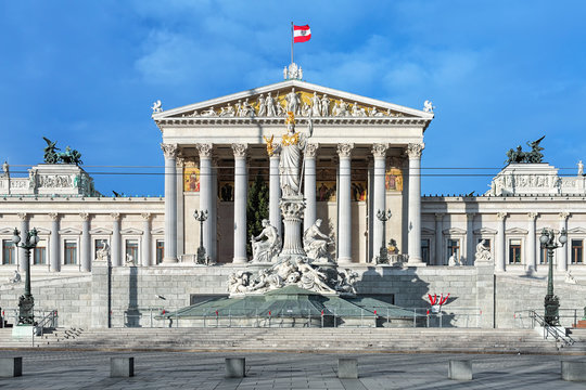 Austrian Parliament Building and Pallas Athene Fountain in Vienna, Austria. The building was completed in 1883. The fountain was erected between 1893 and 1902.
