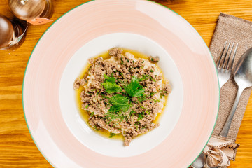 oatmeal with meat in a plate