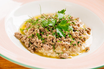 oatmeal with meat in a plate