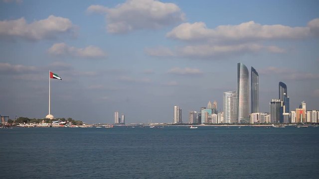 Abu Dhabi skyline with clouds. Establishing shot.