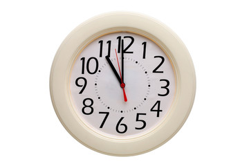 Analog wall clock showing eleven o'clock