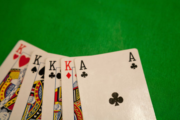 four of a kind poker cards combination on green background casino game fortune luck