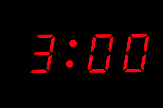 Digital clock displaying three o'clock