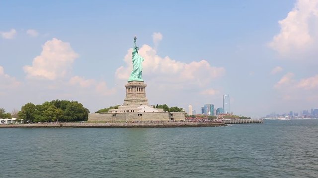 Statue of Liberty with New York skyline on background. Panoramic composition with text space on right side. Travel and landmarks concepts.