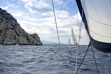 Obraz premium Yachting race/Race in the fresh wind during the regatta in the mediterranean