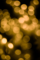 Bokeh light gold defocus at night abstract background.
