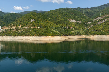 Fototapeta na wymiar Dam of the Vacha (Antonivanovtsy) Reservoir, Rhodopes Mountain, Bulgaria