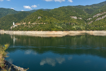 Fototapeta na wymiar Green forest around Vacha (Antonivanovtsy) Reservoir, Rhodopes Mountain, Bulgaria