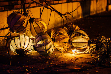 Dirty broken Chinese lanterns lying on the ground