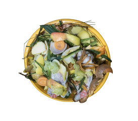 Yellow bowl with kitchen waste, isolated on white background