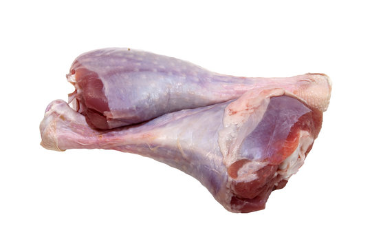 Two raw turkey legs on a white background