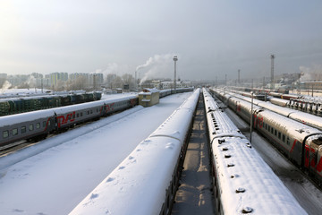 Fototapeta na wymiar Railway in a winter day and snow around