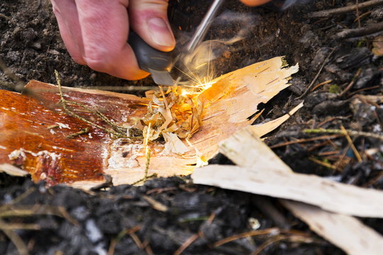 Male Hand Starts Fire With Magnesium Fire Steel, Fire Striker