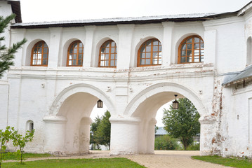 Fototapeta na wymiar Covered gallery in Saviour Priluki Monastery.