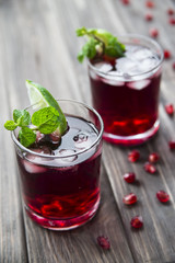 
Pomegranate cocktail with pomegranate seeds, lime and mint. alcoholic and non-alcoholic