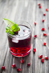 
Pomegranate cocktail with pomegranate seeds, lime and mint. alcoholic and non-alcoholic