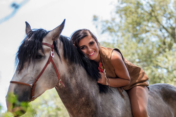 Obraz premium Beautiful girl and horse in nature