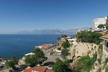 City Walls at the Harbour of Antalya, the 40m High Cliffs and the Taurus Mountains in Turkey