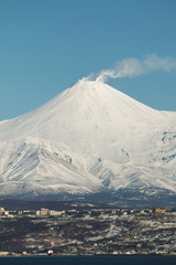 Petropavlovsk Kamchatsky amid the Smoking of Avachinsky volcano