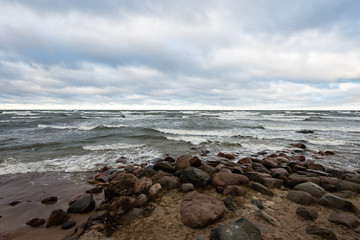 Fototapeta na wymiar rocky sea beach with wide angle perspective
