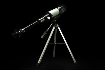 Telescope isolated over black background