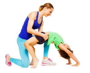 Fototapeta premium Mother helping her kid son making a crab position