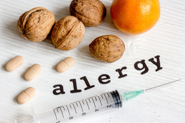 concept food allergies on wooden background