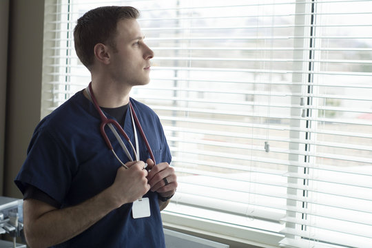 Doctor Looking Out Of Window