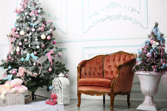 Christmas white interior with brown chair and Christmas tree