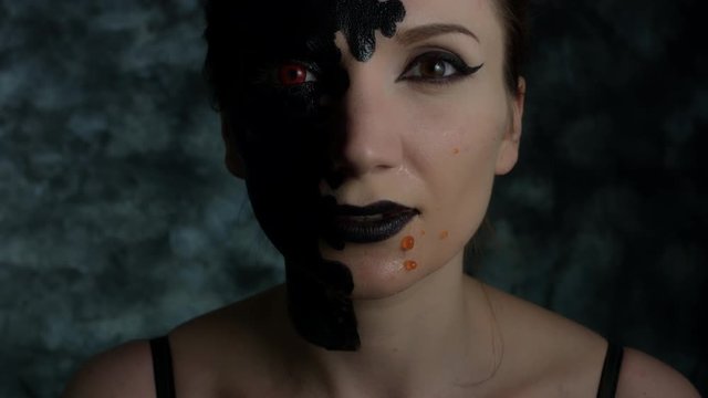 4k Shot of a Woman with Halloween Make-up with Red caviar on Face (reverse)