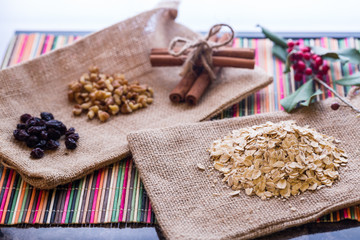Fototapeta premium Dry oatmeal with oatmeal breaksfast ingredients.