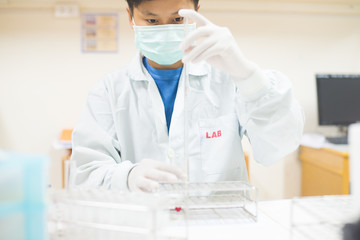 asia scientist working in biological laboratory.