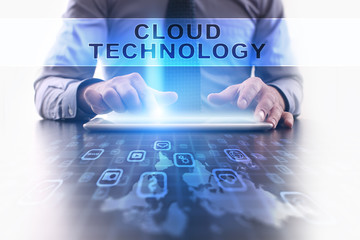 Fototapeta na wymiar cloud technology concept. Businessman working with modern tablet pc.