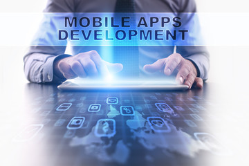Fototapeta na wymiar mobile apps development concept. Businessman working with modern tablet pc.