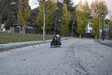 Playing with the skateboard at sunset