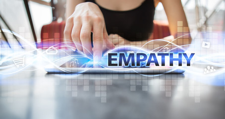 Woman using tablet pc and selecting empathy.