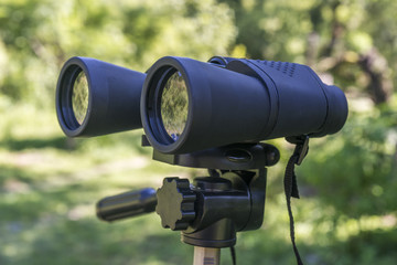 binoculars placed on a tripod