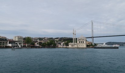 Ortakoy Mosque, Bosphorus Bridge and Strait with Ships, as seen from the European Side of Istanbul, in Turkey