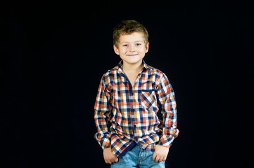 Portrait of a boy on a dark background