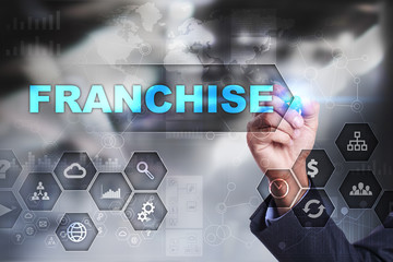 Businessman is drawing on virtual screen. franchise concept.