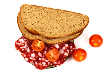 Smoked sausage, cherry tomatoes and bread on a white background