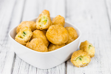 Cheese Nuggets (with Chilis) (selective focus, close-up shot)