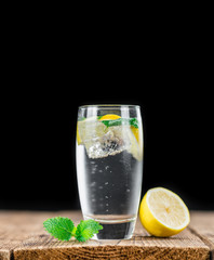 Wooden table with Lemonade (selective focus)