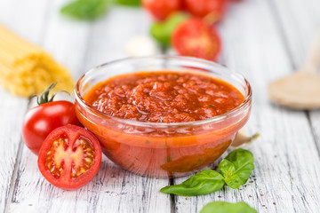 Tomato Sauce (selective focus) on vintage wooden background