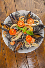 delicious fresh  pasta Neri on plate with shrimp