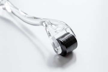 concept beautician desktop with mezoroller - mesotherapy on white background
