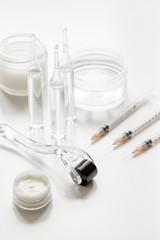 concept beautician desktop with mezoroller - mesotherapy on white background